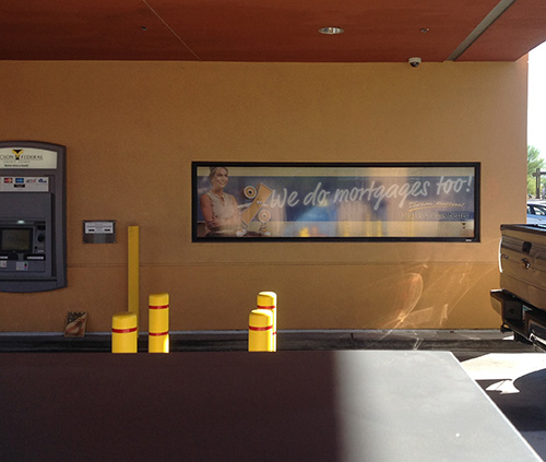 Installed Tucson Federal Credit Union window graphic at a drive-through.